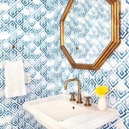 Powder Bath with graphic wallpaper and brass accents