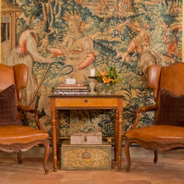 Rich hues and textures fill this reading nook.