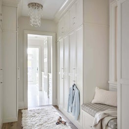 Walk-In Closet, Neutral Palette, White Cabinets, White Rug, Built-in Bench - Lincoln Park Greystone Project