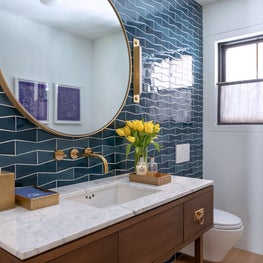 Powder room with Heath Ceramics tile and walnut vanity