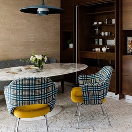 Portfolio: Stunning mid-century breakfast room with brick wall and saarinen table