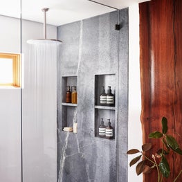 Soulful Home Master Shower with Soapstone and Walnut Slabs on Wall