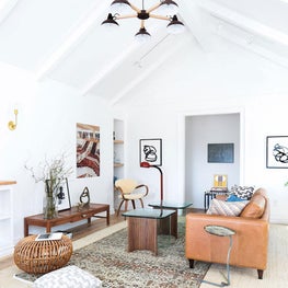 Bright Living Room with Vaulted Ceiling Leather Sofa and Rattan