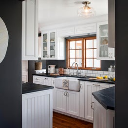 High contrast and classic neutrals makes this kitchen a clean slate for cooking!