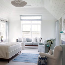 A simple planked ceiling and new fireplace for a beach house