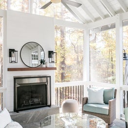 Outdoor fireplace on screen porch