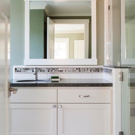 A cool guest bath, with recycled glass tile accents.