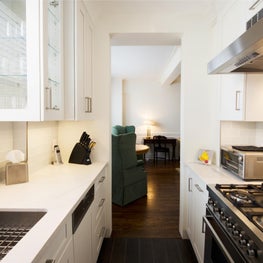 Prewar White Galley Kitchen with Custom Cabinetry 