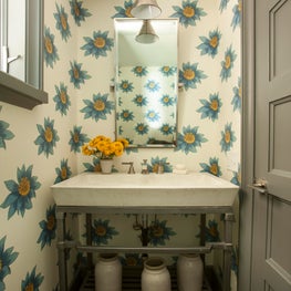 Southern Living Showhouse powder room with floral wallpaper