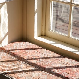 Upstate NY farmhouse, bathroom with upholstered window seat.