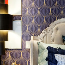 Grand Master Bedroom with custom gold foiled wallpaper.
