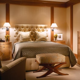 This modern French master suite is connected to a sitting room via pocket doors.