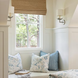 Under the new dormer, we created a charming reading nook within the alcove.