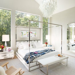 East Hampton Residence - chrome canopy bed with Murano glass chandelier