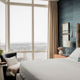 Bedroom with tufted velvet headboard designed by Robin Gannon Interiors