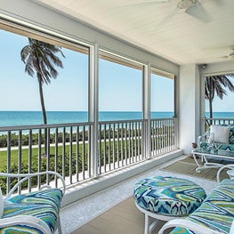 Contemporary Vacation Home with painted white furniture & custom cushions