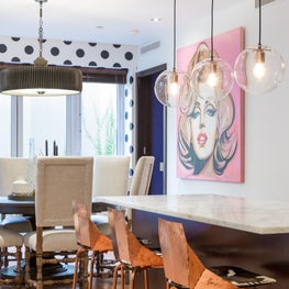 Copper bar stools with cowhide cushions.