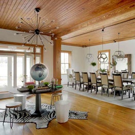 Barn Foyer and Dining Room with Table of Curiosities and Natural Wood Detailing