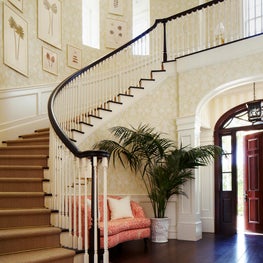 A gracious curving stair in a Palm Beach Entry Hall.