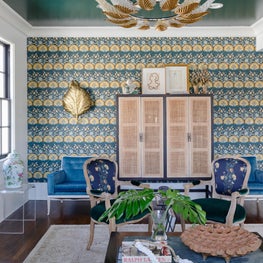 Living Room vignette shot showcasing a bold accent wall and layered furnishings