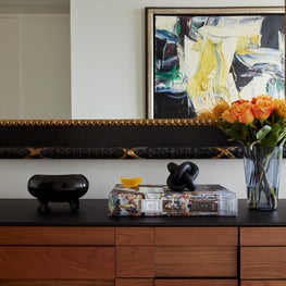 Living room detail close up on sideboard with modern objet d'art