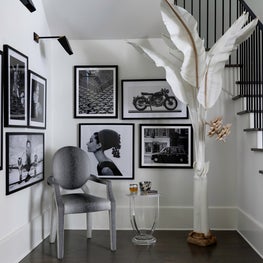 Portfolio: A gallery wall of black and white photos, artwork in a Houston home.