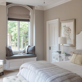Neutral color palette with texture and pattern make this guestroom very inviting