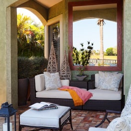 This  comfortable nook was created for a cozy outdoor reading spot.