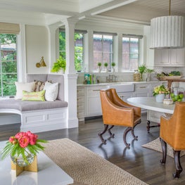 Well Lit Dining Space with Leather Upholstered Chairs, and Build in Benches 
