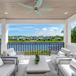 Palm Beach Sleek Contemporary - Outdoor patio/balcony off upstairs living room overlooking intracoastal. Neutral colors, luxurious textiles