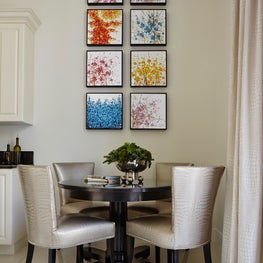 Palm Beach Urban Glamour eating area in kitchen with silk chairs & vibrant art