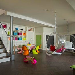 Historic Chestnut Hill Kids Play Room with Hanging Chairs and Colorful Furniture