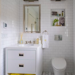 Sunny White Bathroom with Yellow Bath Towels
