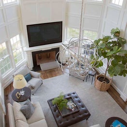 Grand Double-Height Living Room with Millwork and Large Chandelier