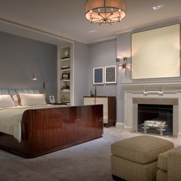 Master Bedroom in Manhattan apartment with fireplace and art