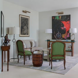 Sitting vignette with custom banquette and recovered Louis chairs 