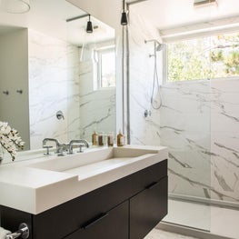 Palisades Bath -  oversized custom sink compliments the dark oak cabinetry. 
