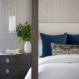 Subdued colors, subtle texture, and sophisticated layers make this primary suite a sensual and spa-like retreat for the homeowners.