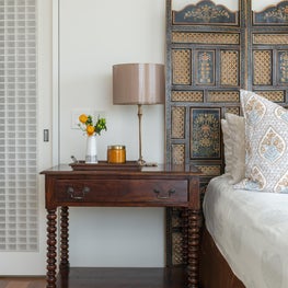 Portfolio: Indo-Asian inspired bedroom with a custom antique headboard 