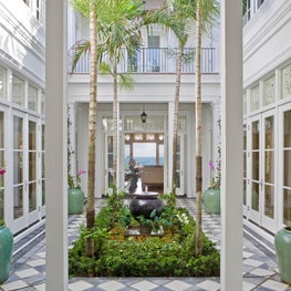 Antique marble tile in a riad-style courtyard with ocean views