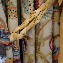 Custom drapery panels tied back with our unique twist and a vintage YSL horn
