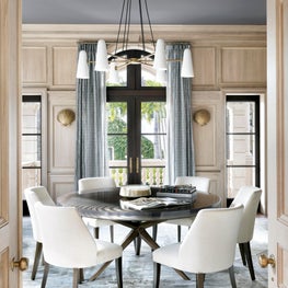 Bleached oak high waisted wainscot in a transitional Palm Beach Dining Room