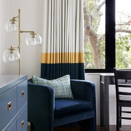 Inspired by the son's love of soccer, his favorite team colors throughout the bedroom and bath.