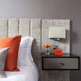 Master bedroom, Butlers Wharf London, with bespoke upholstered headboard