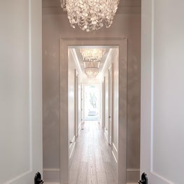 Modern entryway with elegant lighting fixtures