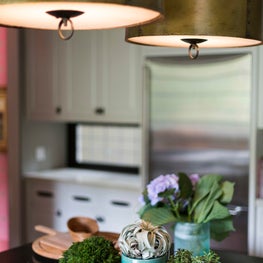 Kitchen island with Brass pendants