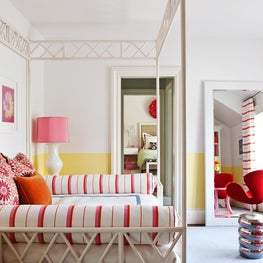 Pink and Yellow Girl's Bedroom with Canopy Bed