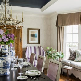 Colorful lavender and purple dining room gold accents window seat ginger jar