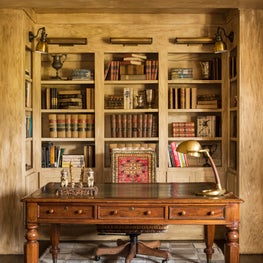 Library with lawyer's desk and antique book collection
