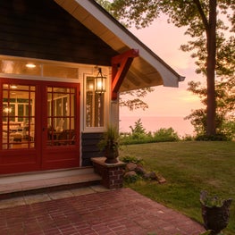 Lake Michigan Cottage: Glazed porch entry on the lake side of the house.